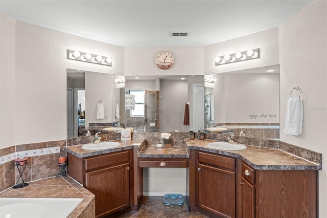 1805 Kingsmill Dr, Bartow, FL 33830 - bathroom with two vanities, a stall shower, and a garden tub