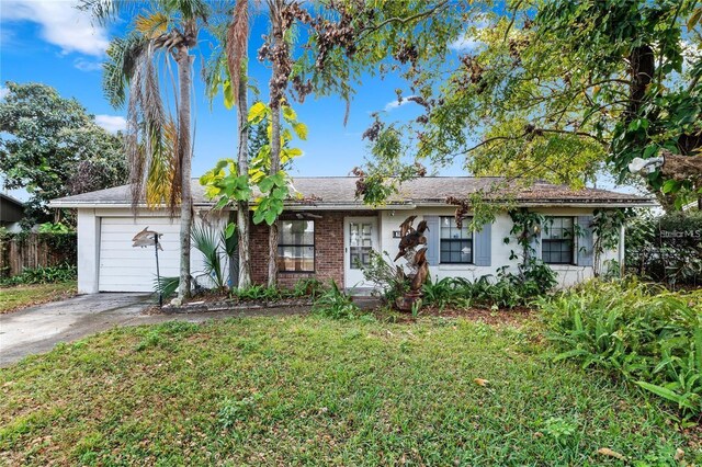 7024 Harwick Dr, Orlando, FL 32818 - single story home featuring concrete driveway and an attached garage