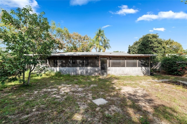 7024 Harwick Dr, Orlando, FL 32818 - back of house featuring a sunroom