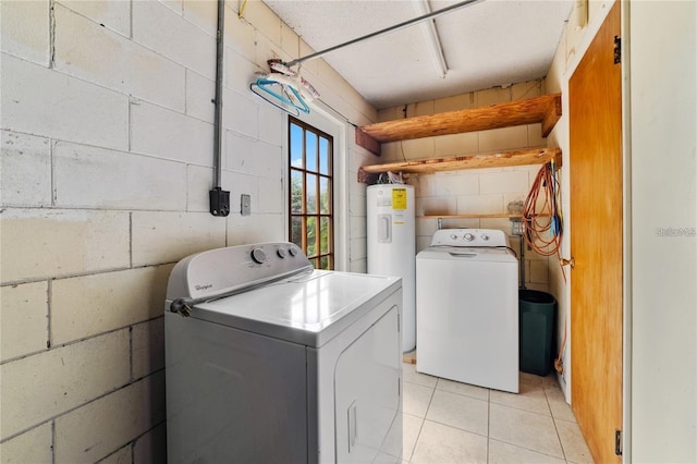 7024 Harwick Dr, Orlando, FL 32818 - washroom featuring separate washer and dryer, electric water heater, light tile patterned flooring, and concrete block wall