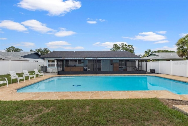 14506 Sutter Pl, Tampa, FL 33625 - view of pool featuring a sunroom, a fenced backyard, central AC, and a patio