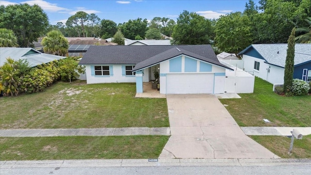 14506 Sutter Pl, Tampa, FL 33625 - view of front of house with an attached garage, concrete driveway, and a gate