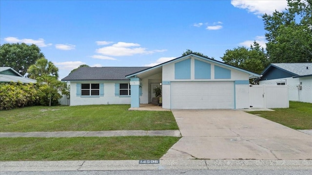 14506 Sutter Pl, Tampa, FL 33625 - view of front facade featuring a garage, stucco siding, concrete driveway, and a gate