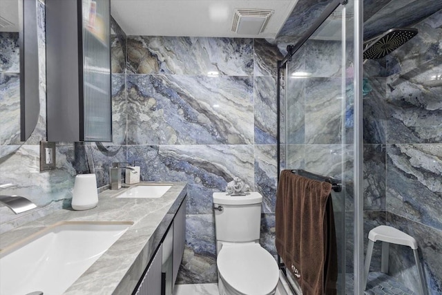 14506 Sutter Pl, Tampa, FL 33625 - bathroom with tile walls, double vanity, a stall shower, and toilet