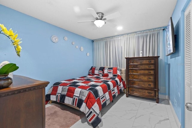 14506 Sutter Pl, Tampa, FL 33625 - bedroom with baseboards, marble look tiles, and a ceiling fan