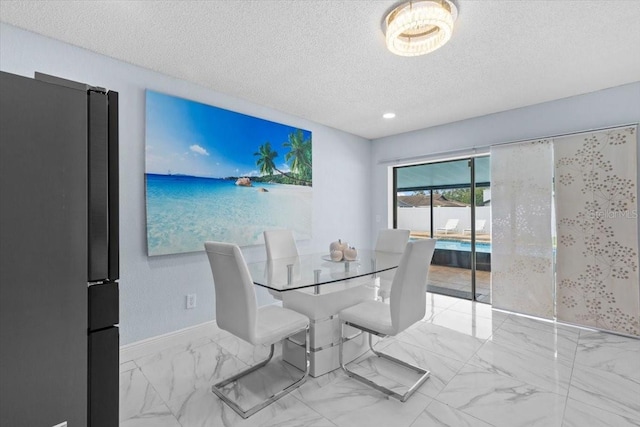 14506 Sutter Pl, Tampa, FL 33625 - dining area featuring a textured ceiling, baseboards, marble finish flooring, and recessed lighting