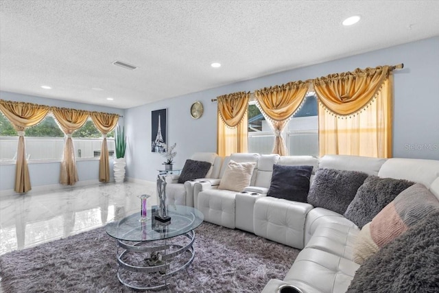14506 Sutter Pl, Tampa, FL 33625 - living area with a textured ceiling, marble tiled floors, recessed lighting, and baseboards