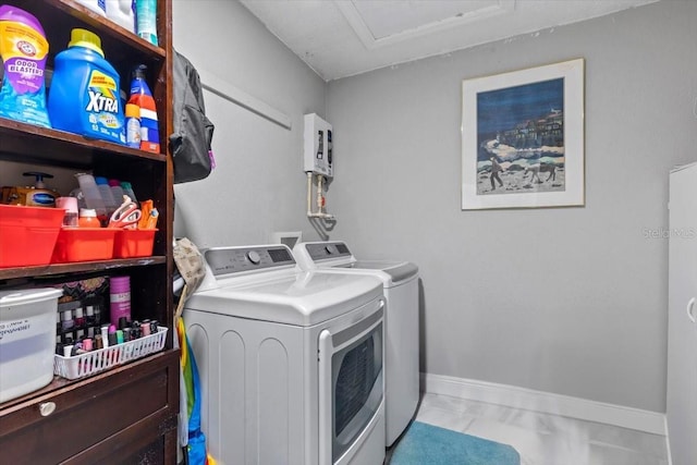 14506 Sutter Pl, Tampa, FL 33625 - laundry area with washing machine and dryer and baseboards