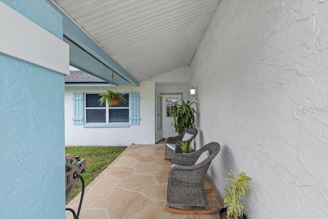 14506 Sutter Pl, Tampa, FL 33625 - property entrance featuring stucco siding and a patio area