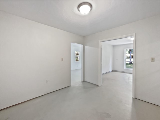 13794 SW 112th St, Dunnellon, FL 34432 - spare room with concrete floors