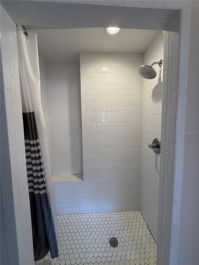full bath with a shower stall and recessed lighting
