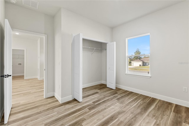 17762 SW 33rd Ter, Ocala, FL 34473 - unfurnished bedroom with light wood-type flooring, baseboards, and a closet