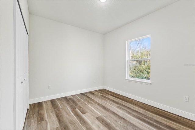 17762 SW 33rd Ter, Ocala, FL 34473 - unfurnished bedroom with baseboards and wood finished floors