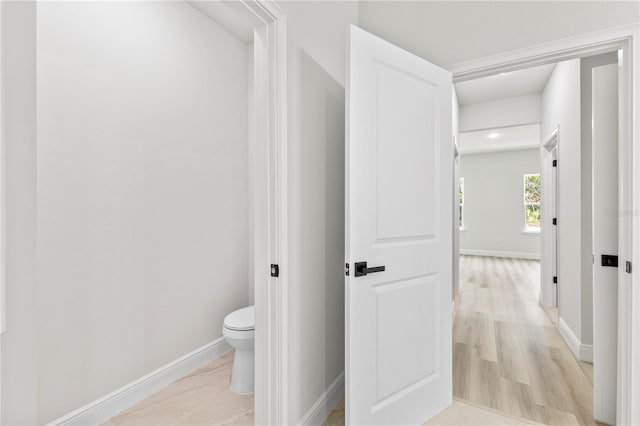 17762 SW 33rd Ter, Ocala, FL 34473 - bathroom with toilet, baseboards, and wood finished floors