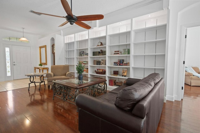 13631 Via Roma Cir, Clermont, FL 34711 - living room with ceiling fan, hardwood / wood-style floors, and arched walkways