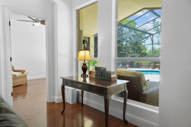 13631 Via Roma Cir, Clermont, FL 34711 - hall featuring a sunroom, healthy amount of natural light, and wood finished floors
