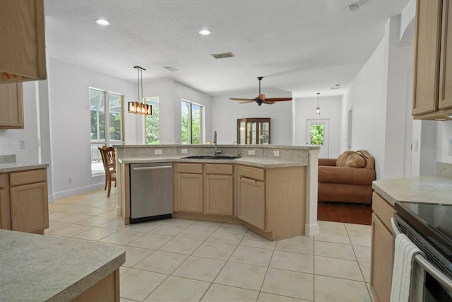 13631 Via Roma Cir, Clermont, FL 34711 - kitchen featuring stainless steel appliances, open floor plan, light countertops, light brown cabinetry, and recessed lighting
