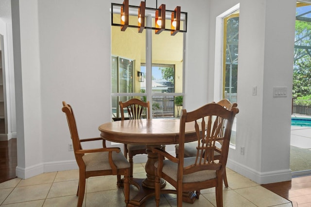 13631 Via Roma Cir, Clermont, FL 34711 - dining space with healthy amount of natural light and light tile patterned floors