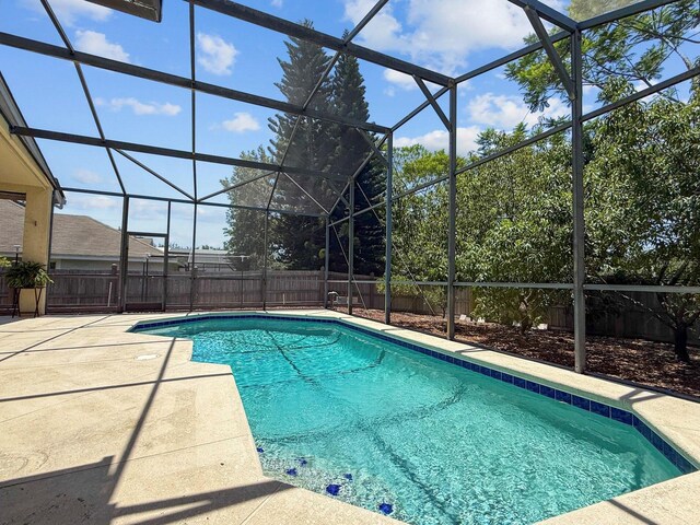 13631 Via Roma Cir, Clermont, FL 34711 - view of swimming pool with a fenced backyard, a patio area, and glass enclosure