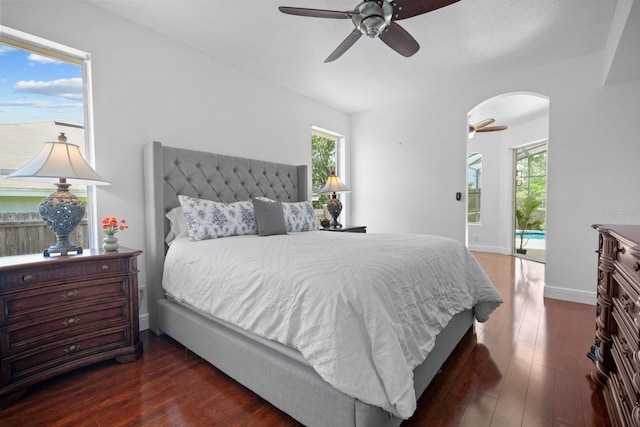 13631 Via Roma Cir, Clermont, FL 34711 - bedroom featuring arched walkways, wood finished floors, and a ceiling fan