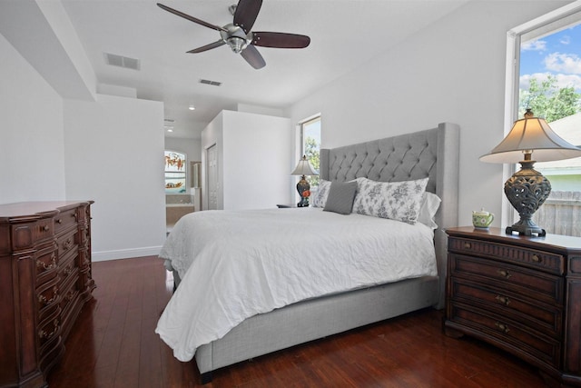 13631 Via Roma Cir, Clermont, FL 34711 - bedroom featuring dark wood-type flooring, ensuite bathroom, recessed lighting, and a ceiling fan