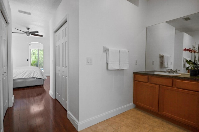 13631 Via Roma Cir, Clermont, FL 34711 - ensuite bathroom with vanity and a ceiling fan