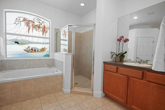 13631 Via Roma Cir, Clermont, FL 34711 - bathroom featuring a stall shower, a bath, vanity, tile patterned floors, and recessed lighting