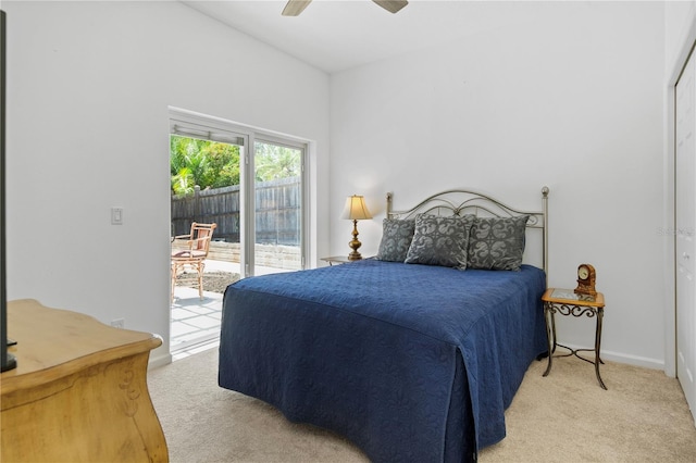 13631 Via Roma Cir, Clermont, FL 34711 - bedroom with light colored carpet, access to outside, and ceiling fan