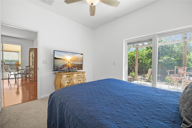 13631 Via Roma Cir, Clermont, FL 34711 - carpeted bedroom with multiple windows, access to exterior, and a ceiling fan