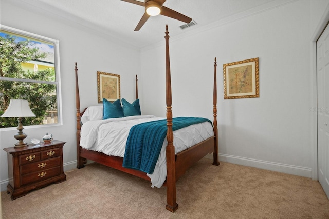 13631 Via Roma Cir, Clermont, FL 34711 - bedroom with light carpet, ornamental molding, and a ceiling fan