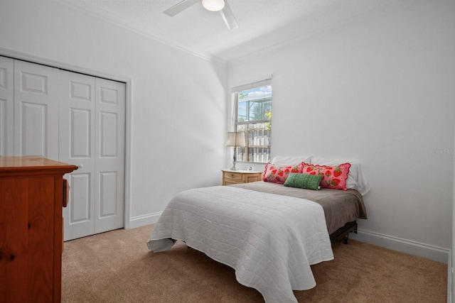 13631 Via Roma Cir, Clermont, FL 34711 - bedroom with carpet floors, ornamental molding, a ceiling fan, and a closet