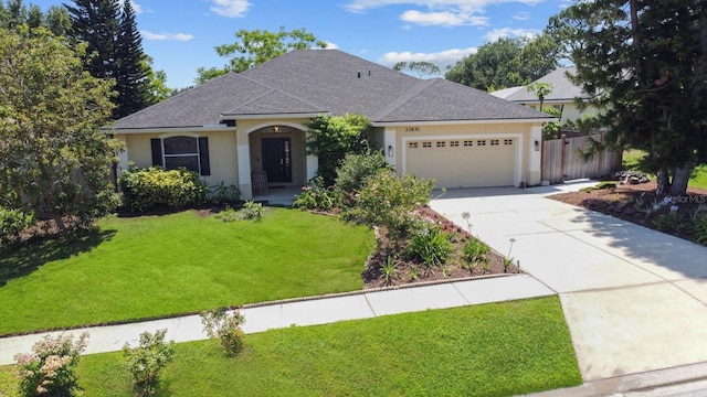 13631 Via Roma Cir, Clermont, FL 34711 - view of front of house with stucco siding, concrete driveway, an attached garage, and a shingled roof