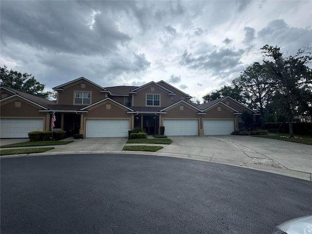 1212 Georgia Trace Ave, Valrico, FL 33596 - view of front of house featuring concrete driveway, a garage, and stucco siding