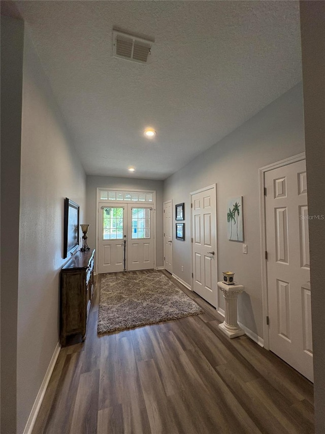 1212 Georgia Trace Ave, Valrico, FL 33596 - foyer featuring wood finished floors, baseboards, recessed lighting, and a textured ceiling