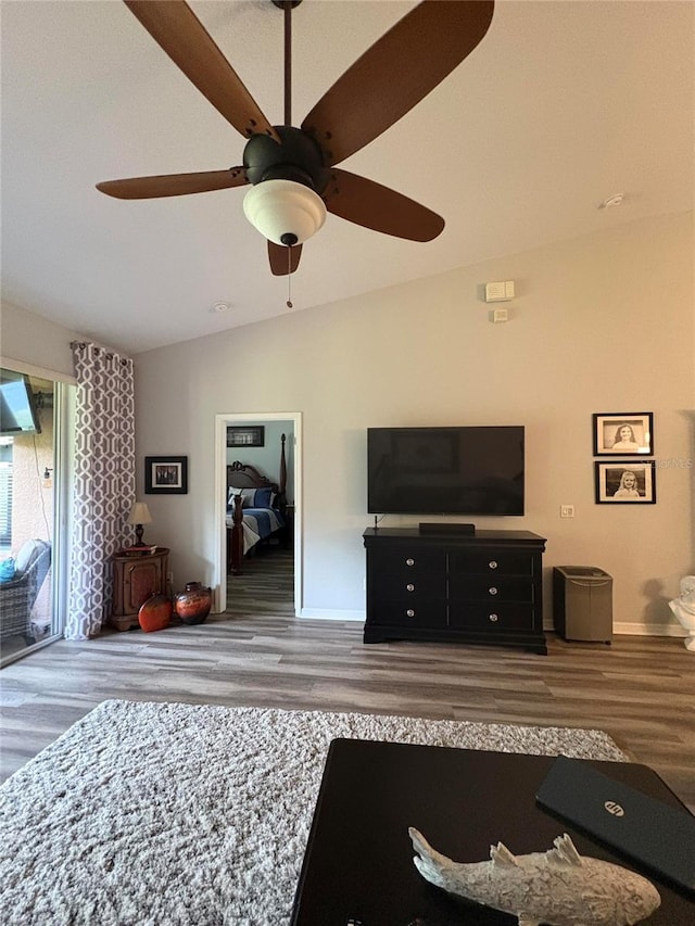 1212 Georgia Trace Ave, Valrico, FL 33596 - living area with wood finished floors, lofted ceiling, a ceiling fan, and baseboards