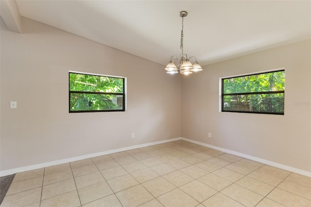212 Homewood Dr, Sanford, FL 32773 - spare room featuring a chandelier, vaulted ceiling, and light tile patterned floors