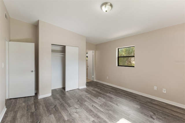 212 Homewood Dr, Sanford, FL 32773 - unfurnished bedroom with wood finished floors and a closet
