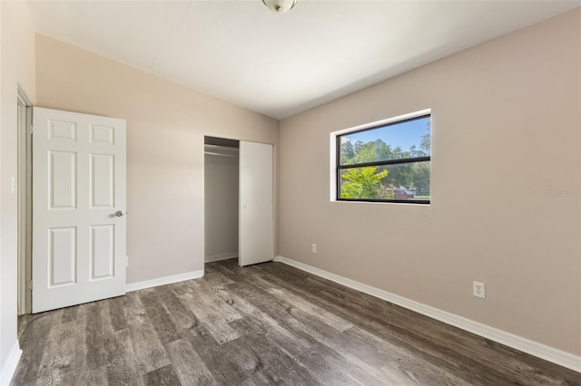 212 Homewood Dr, Sanford, FL 32773 - unfurnished bedroom with wood finished floors and a closet