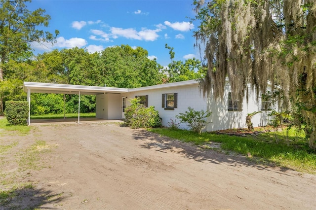 212 Homewood Dr, Sanford, FL 32773 - view of front of home with driveway and an attached carport
