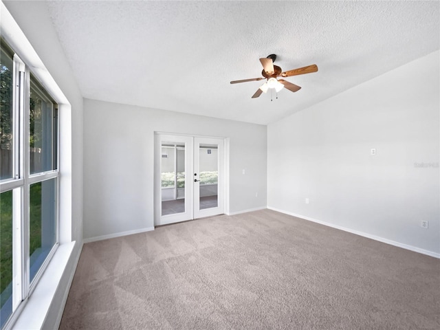612 Doe Cove Pl, Apopka, FL 32703 - spare room with french doors, carpet floors, ceiling fan, a textured ceiling, and baseboards