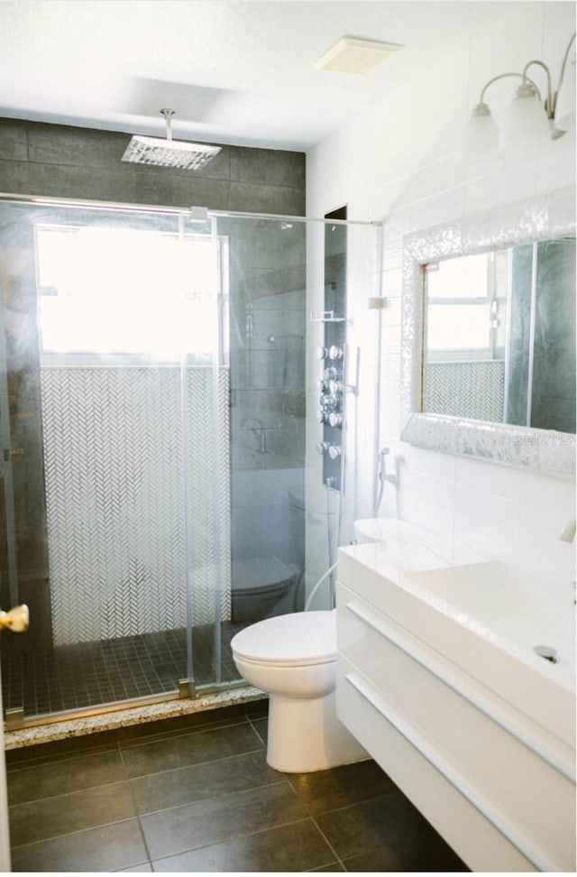 2102 Applegate Dr, Ocoee, FL 34761 - full bathroom with vanity, toilet, tile patterned floors, and a shower stall
