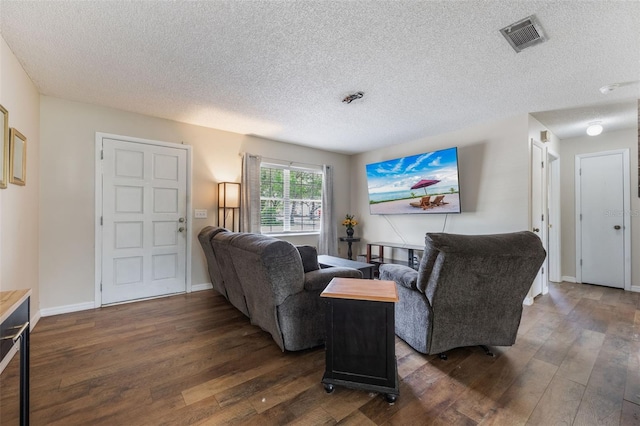1198 E Hancock Dr, Deltona, FL 32725 - living room with dark wood finished floors, a textured ceiling, and baseboards
