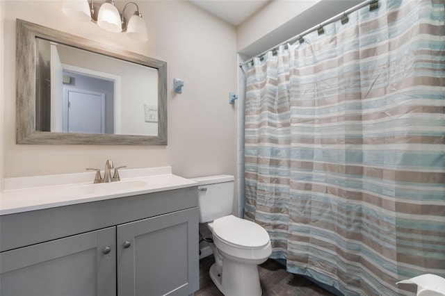 1198 E Hancock Dr, Deltona, FL 32725 - bathroom with vanity, toilet, and wood finished floors