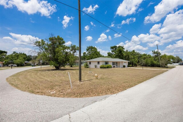 1198 E Hancock Dr, Deltona, FL 32725 - single story home with a front lawn and curved driveway