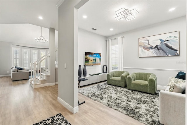 704 Honeysuckle Ave, Kissimmee, FL 34747 - living area with plenty of natural light, baseboards, wood finished floors, and recessed lighting
