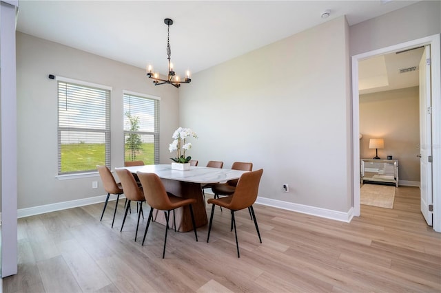 16489 Silver Brook Way, Winter Garden, FL 34787 - dining space with a chandelier, light wood-type flooring, and baseboards