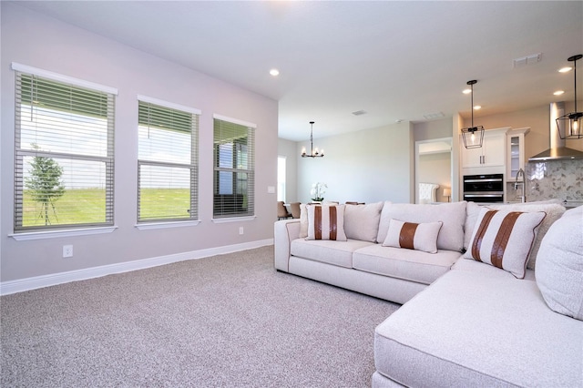 16489 Silver Brook Way, Winter Garden, FL 34787 - carpeted living area with a chandelier, baseboards, and recessed lighting