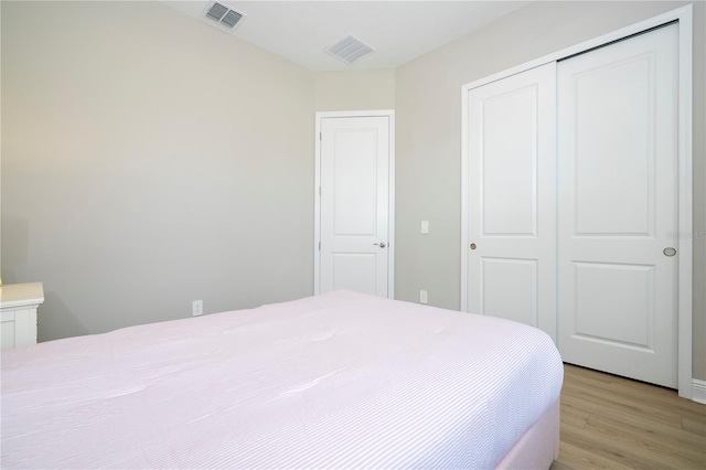 16489 Silver Brook Way, Winter Garden, FL 34787 - bedroom with a closet and light wood-style floors