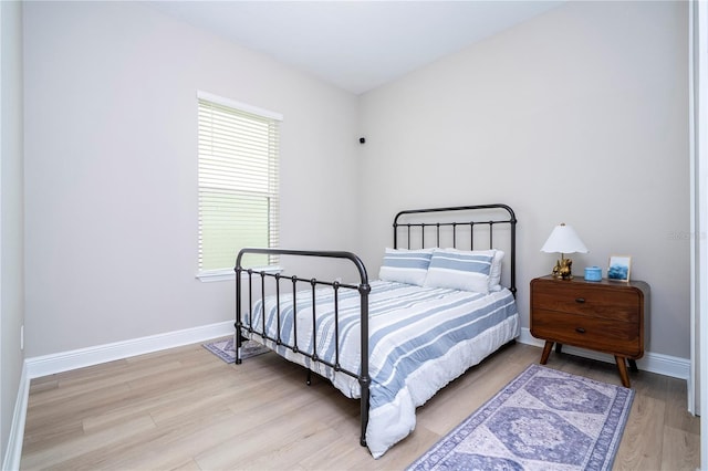 16489 Silver Brook Way, Winter Garden, FL 34787 - bedroom featuring light wood-type flooring, baseboards, and multiple windows