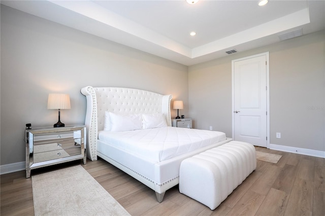 16489 Silver Brook Way, Winter Garden, FL 34787 - bedroom featuring wood finished floors, recessed lighting, baseboards, and a tray ceiling